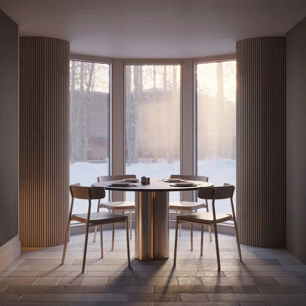 Une salle à manger moderne et élégante avec une table ronde entourée de chaises en bois, baignée par la douce lumière d'une grande baie
