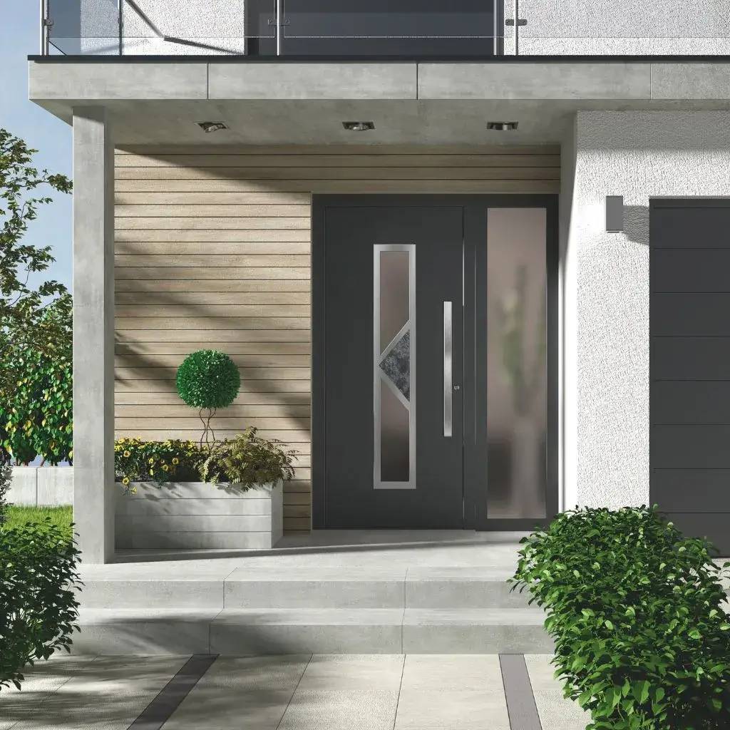 Entrée moderne avec une porte noire élégante, entourée de plantes et de murs texturés.