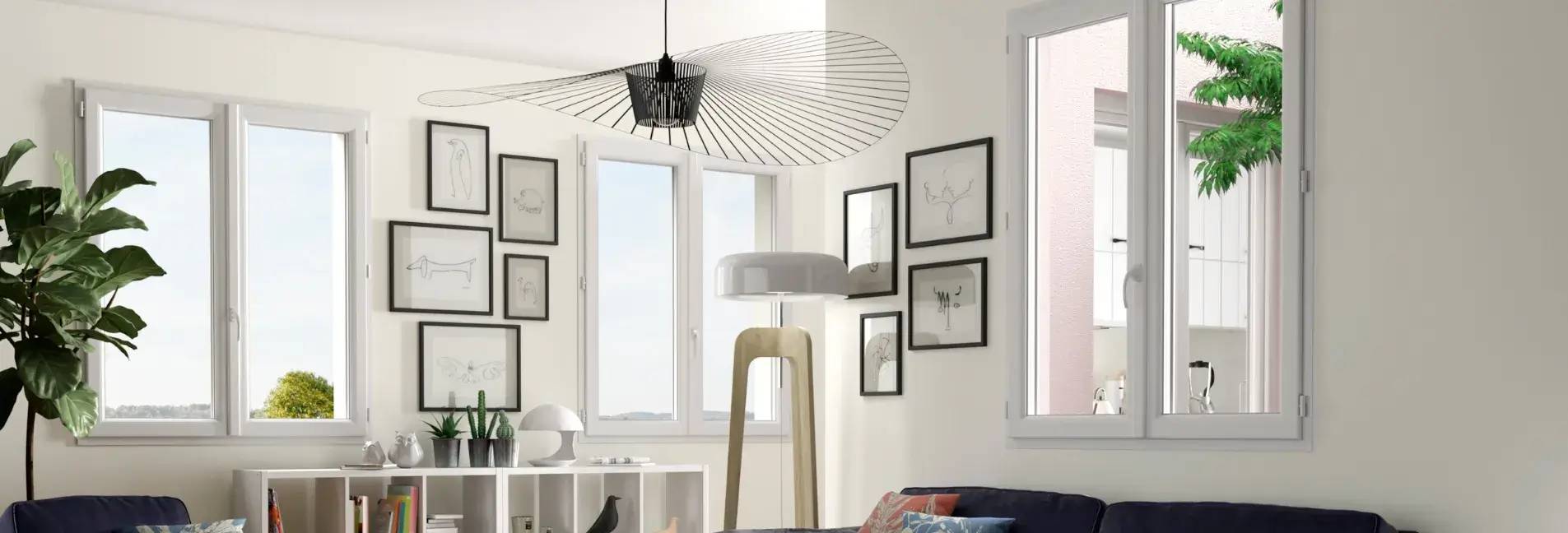 Un salon lumineux au design moderne avec des cadres minimalistes et une grande plante verte près des fenêtres.