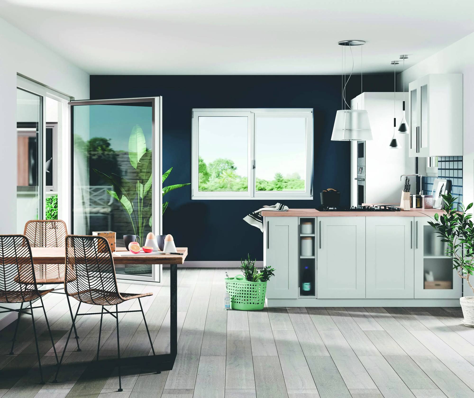 Cuisine moderne avec des meubles blancs, un mur bleu foncé, et des touches de décoration végétale.